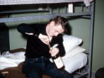 George Smith Attempting to Open a Bottle of Booze
