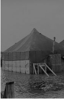 Tents surrounded by water in flat areas