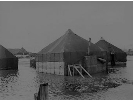 Tents surrounded by water in flat areas