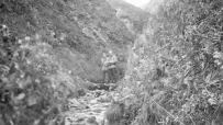 Attu, 1943. Exploring the mountains of Attu. [Mack Collings]