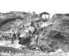 Landing forces discover Japanese midget submarines on a marine railway. May 1943.  [George Villasenor]