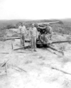 75mm Japanese Gun. Pictured are Ray Vaughn, Norton, and Sjosten.  [Allan Moore]