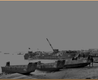 Landing men and supplies on Attu's Massacre Beach, 11 May 1943. [George Smith]