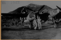 P-38 and crew, Alexai Point, Attu, AK. Notice the Perforated Steel Plating (PSP) runway! [George L. Smith]