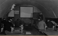 Brodie teaching a religious study class on Attu. [Robert Brodie]