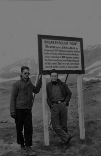 Howard Miles and George Brown on Attu at the "Breakthrough Point" sign. [Robert Brodie]