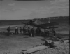 OS2U crew securing wheels and tow line, ATTU, 21 June 45.  [George Villasenor]