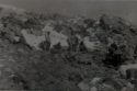 Squad sprawled along the side of a mountain searching for the Japanese defenders.  [Ed Nielsen]