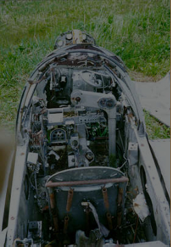 Attu; P-38 Crash Site. The Cockpit has been stripped of instruments.  [Philip Nell]