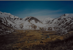 View of Black Mountain, with Jarmin Pass on the right, and Zwinge Pass on the left. Scene of fierce fighting during the Battle of Attu, May 1943.  [Russ Marvin]