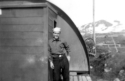 Bill Greene in front of his hut.  [Bill Greene]