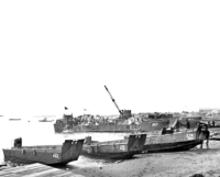 Landing men and supplies on Attu's Massacre Beach, 11 May 1943. [George Smith]