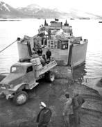 Landing men and supplies on Attu's Massacre Bay Beach. 11 May 1943. [George Smith]