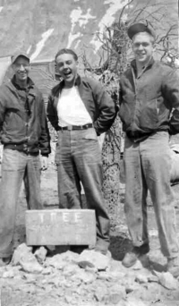 Brodie, Nissing, Boraske posing near the only "tree" (man made) on Attu. [Robert Brodie]