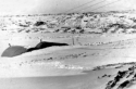 Attu. The snow was so deep you can barely see the top of our hut! During the winter months you had to dig a trench to find the door. [Al Gloeckler]