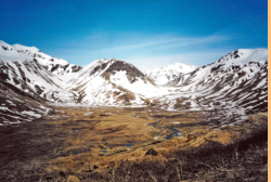 View of Black Mountain, with Jarmin Pass on the right, and Zwinge Pass on the left. Scene of fierce fighting during the Battle of Attu, May 1943.  [Russ Marvin]