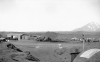 Umnak Air Base, 1943 after the snow had melted. In the right foreground is our Dispensary. We had our own generator for electricity. One man was responsible to keep it running.  [Don Blumenthal]