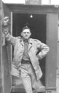 Me standing in the entrance way of the Air Base Dispensary on Umnak in 1943. Note the black out entrance. This the only one of the islands where we used this.   [Don Blumenthal]