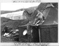 12. Who can't forget the spark arrestor at the top of the tent, that's Ingles fooling around. Quonset hut is headquarters.  [Ed Sidorski]