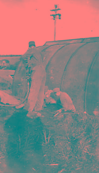 Refueling Oil For The Hut Heater; Using Discarded Wing Tank To Store Oil. [Robert Koppen]