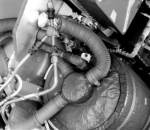 [73698: 3/3/1960]  Top of Liquid Nitrogen Cooling Tank, showing flex tubing that routes cool air to G&C package. Aluminum tubing was high pressure air feeding tank to circulate nitro for cooling.  [CCMD, Ed May]