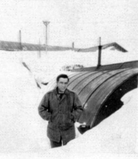 Nick Moreska, fall of 1944, with the 7th Div 159th Inf. Regiment, in front of his hut. [Nick Moreska]