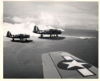 OS2U Observation aircraft, attached to either the USS Trenton or Concord, US Navel Task Force 92, flying over Attu’s Alexai Point.  [George Villasenor]