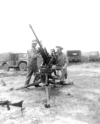 Japanese 20mm gun. Pictured are Ray Vaughn and H. D. Johnson.  [Allan Moore]