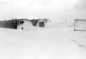 Paint Shop (left) and Carb Shop (right) during storm. Attu, 1945.  [Elbert McBride]