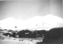 More Quonset Huts in the snow. Attu, 1945.  [Elbert McBride]