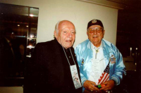 Wilbur Green, waving the flag, and Bob Nesmith (left) attending 10th ERBS reunion, Newport Beach, CA.  [Wilbur Green]