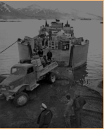 Landing men and supplies on Attu's Massacre Bay Beach. 11 May 1943. [George Smith]