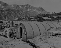 Soldiers working on the Attu Station Hospital Project constructed of prefabricated huts, 26 Sep 1943. [U. S. Army Photo]
