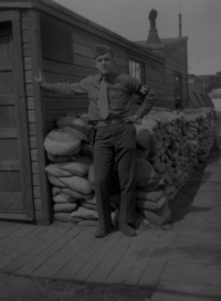 J. Rene "Frenchy" Thibault standing by the Guard Shack's door, Attu 1946. [Rene Thibault]