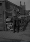 J. Rene "Frenchy" Thibault standing by the door of the Guard Shack, Attu, 1946.  [Rene Thibault]