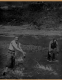 You can see the salmon splashing as they attempt to get upstream. On the left is Anthony Cash, I'm on the right. [Al Gloeckler]