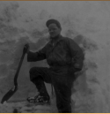 Shoveling into a Quonset hut on Attu. Person unknown.  [Al Gloecker]