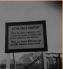 A sign located near Little Falls Cemetery on Attu detailing the casualties inflicted during the capture of Attu.  [Elbert McBride]