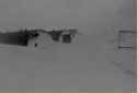 Paint Shop (left) and Carb Shop (right) during storm. Attu, 1945.  [Elbert McBride]