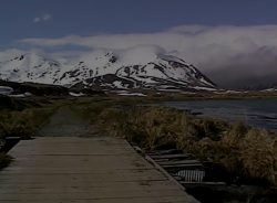 Along the shores of Massacre Bay, looking toward Massacre Valley. Gilbert Ridge is in the background.  [Russ Marvin]