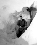 Griego shoveling out the entrance to our Hut.  [Bill Greene]