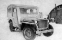 Not too great in tundra. [Note: Jeeps throughout the Aleutian chain were outfitted with these wooden enclosures to protect occupants from the weather]  [Bill Greene]