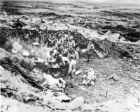 First Jap defenses on Attu fall: troops gather around a field stove, Holtz Bay area, for a hot breakfast, 29 May 1943. [Navy Photo]