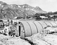 Soldiers working on the Attu Station Hospital Project constructed of prefabricated huts, 26 Sep 1943. [U. S. Army Photo]
