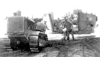 This picture, and the next, were of barges beached at the Outpost. The back of one barge was torn off by the rough waters of the Bearing Sea.  [Vince Kotouch]