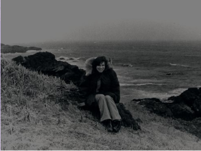 Barbara Nowak sitting at ocean's edge