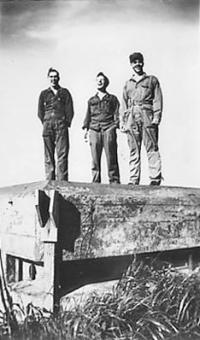 Robert, Ruben, and Chuck Looking Down To The Garbage Dump & Storage Area. [Robert Koppen]